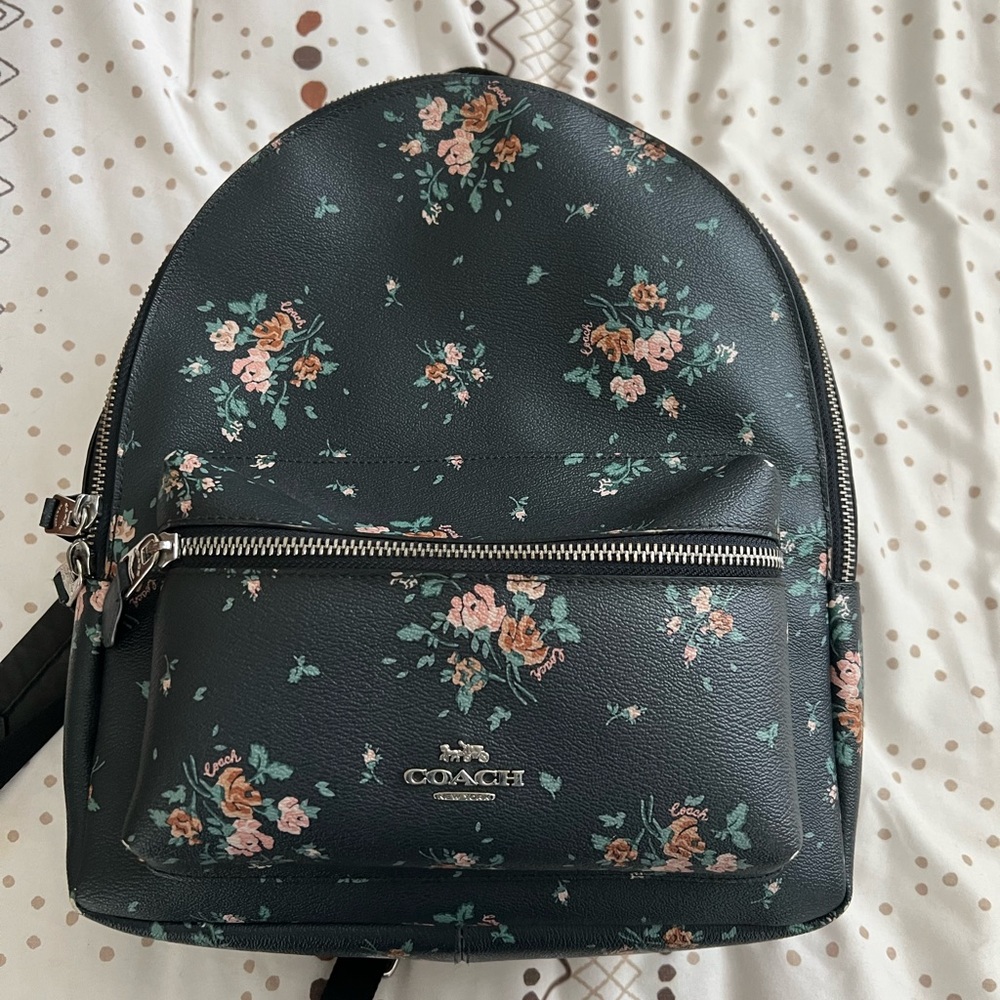 Medium size navy blue floral coach back pack